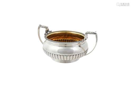 A George III silver twin handled sugar bowl by Samuel Hennel...