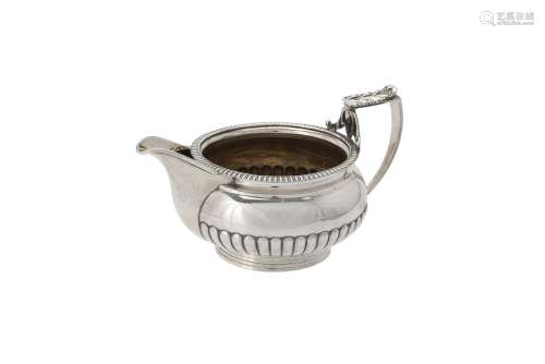 A George III silver half lobed cream jug by Samuel Hennell &...