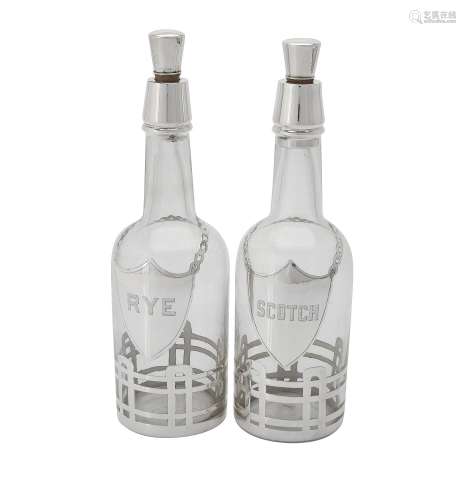 Two American glass decanters with silver coloured overlay