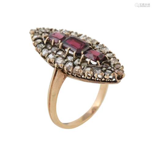 A garnet and diamond navette shaped cluster ring