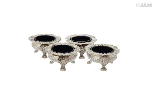 A set of four George IV silver shaped circular cauldron salt...