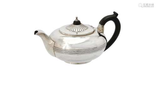 A George III silver compressed circular tea pot by Rebecca E...