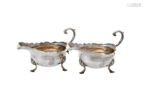 A pair of George II silver shaped oval sauce boats