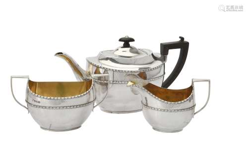 An Edwardian silver oval three piece tea set by Maxfield & S...