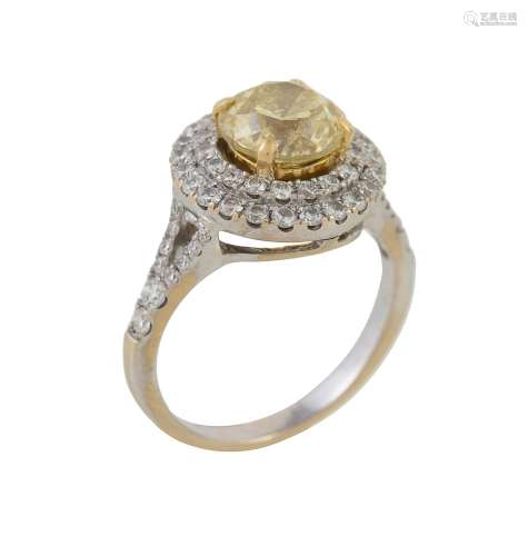 A yellow diamond and diamond cluster ring