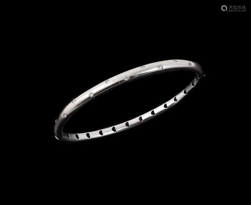 A diamond set hinged bangle