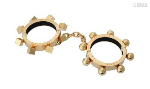 Louis Vuitton, a pair of gold plated handcuff bangles