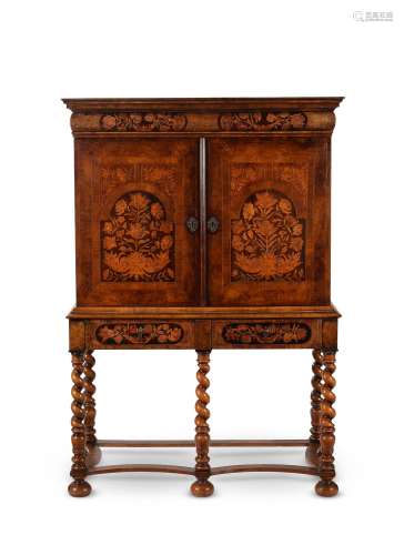 A William and Mary walnut and marquetry cabinet on stand
