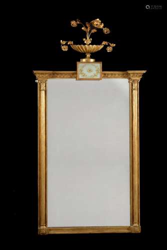 A Regency giltwood and verre eglomise wall mirror