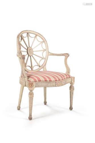 A George III cream painted and parcel gilt open armchair