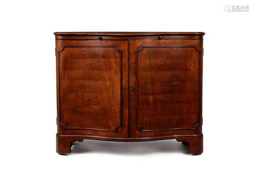 A George III mahogany serpentine fronted commode or side cab...