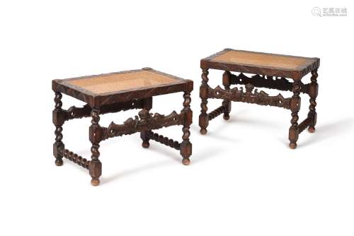 A pair of carved oak and caned stools, , in Charles II style