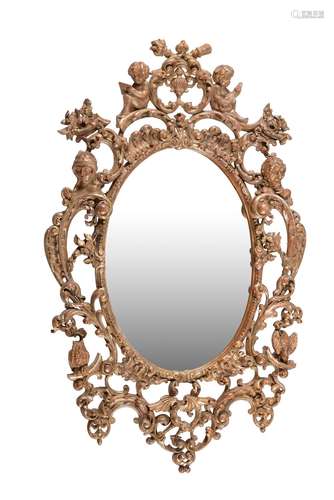 A carved wood and silvered oval wall mirror, second half 18t...