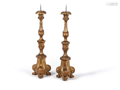 A pair of Italian giltwood altar candlesticks, 18th century