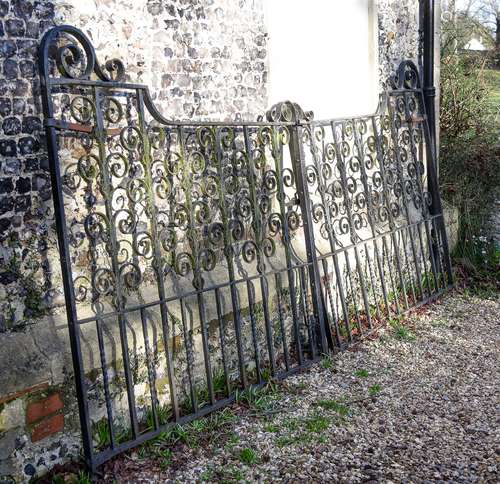 A pair of black painted cast and wrought iron gates, early 2...