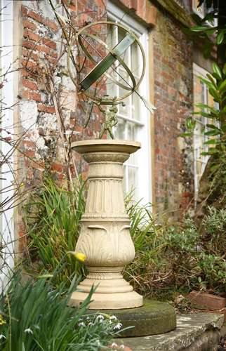 A metal, cast iron and stone mounted armillary sphere