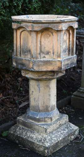 A Victorian terracotta garden font in Gothic Revival style