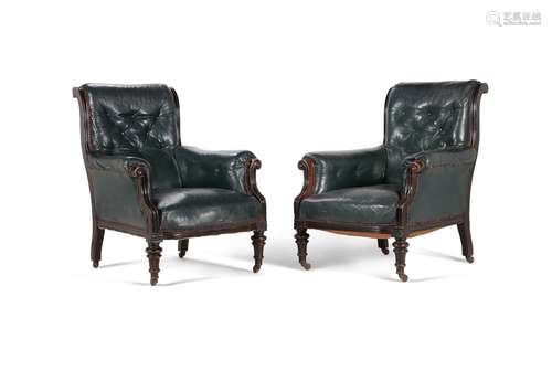 A pair of Victorian ebonised and leather upholstered armchai...