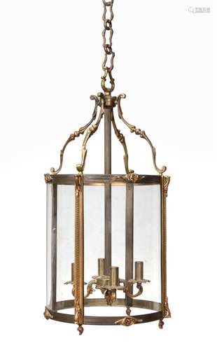 A gilt metal and glazed cylindrical hall lantern