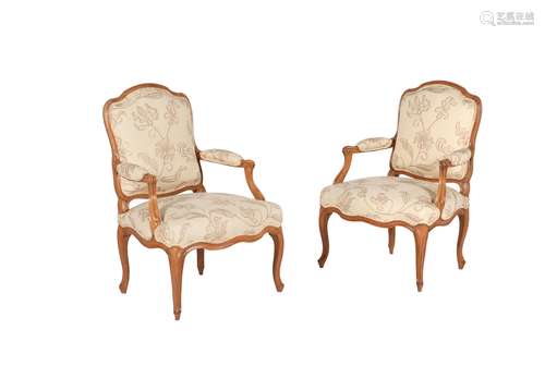 A pair of Louis XV beech and upholstered fauteuil