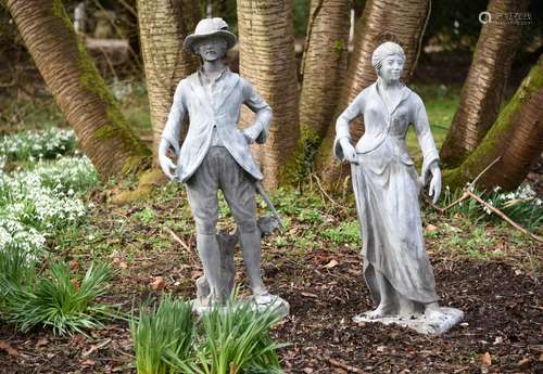 A pair of lead garden models of a pastoral couple