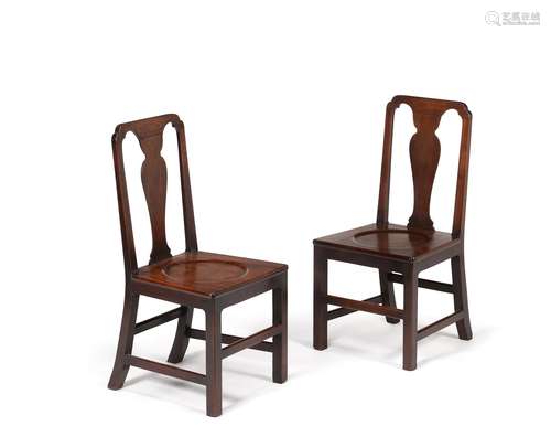 A set of six George II mahogany hall chairs