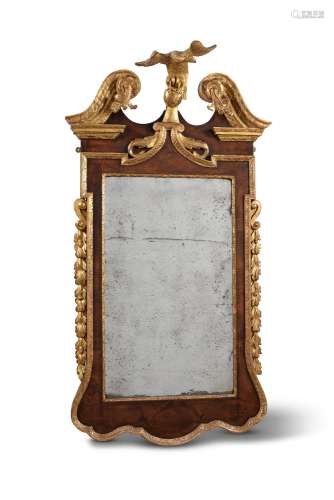A George ll walnut and parcel gilt mirror