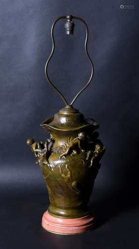 An Art Nouveau patinated bronze vase table lamp, to a design...