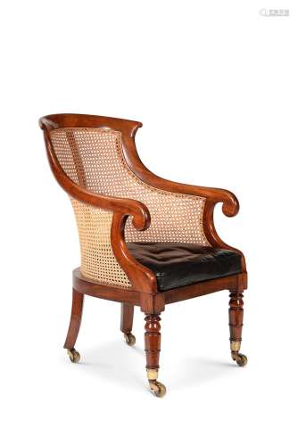 A Regency mahogany and caned bergere library armchair