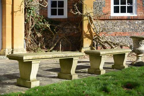 A pair of stone garden benches in Neoclassical style, 20th c...