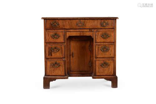 A George II walnut and crossbanded kneehole desk