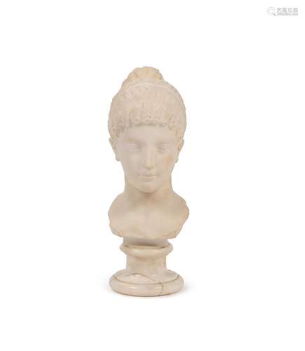 A sculpted white marble bust of a young woman in Neoclassica...