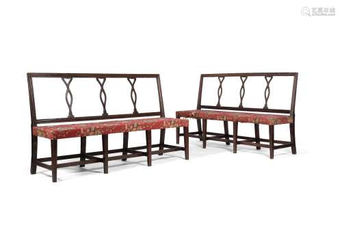 A pair of George III mahogany hall benches