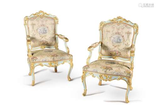 A pair of Italian carved wood, painted and parcel gilt armch...