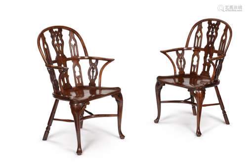 A pair of yew and mahogany Gothic Windsor armchairs