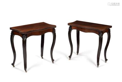 Y A pair of Victorian rosewood serpentine folding card table...