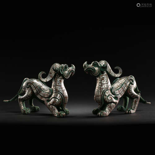 A PAIR OF CHINESE BEASTS INLAID WITH SILVER, WARRING STATES ...