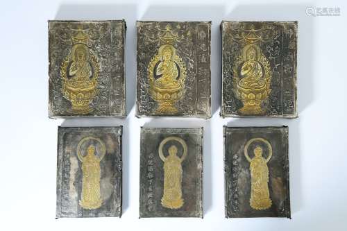 a group of chinese silver buddha statues