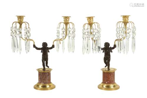 A PAIR OF EARLY 20TH CENTURY BRONZE AND CUT GLASS FIGURAL CA...