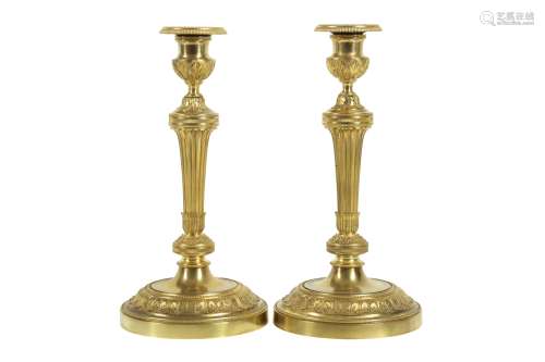 A PAIR OF 19TH CENTURY FRENCH GILT BRONZE CANDLESTICKS AFTER...