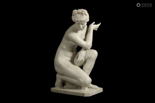 A LARGE CARVED MARBLE FIGURE OF THE CROUCHING VENUS, AFTER T...