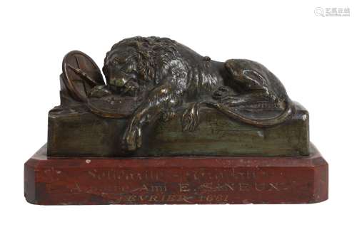 A 19TH CENTURY FRENCH BRONZE MODEL OF A SLEEPING LION