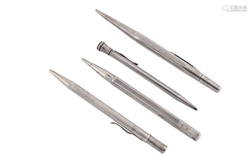 A group of four silver propelling pencils