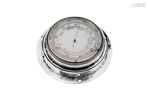 An Edwardian sterling silver mounted ships barometer, London...