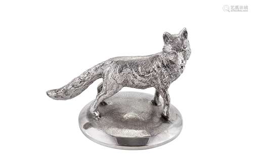 A modern cast unmarked silver model of a fox