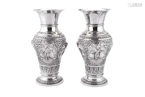 A pair of mid-20th century Indian unmarked silver vases, pro...