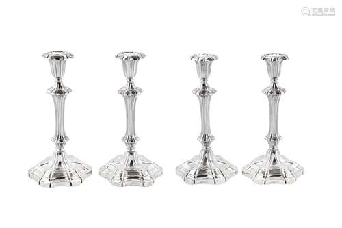 A set of four early Victorian sterling silver candlesticks, ...