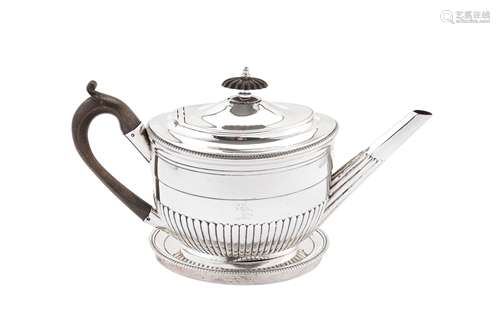 A George III sterling silver teapot on stand, the teapot Lon...