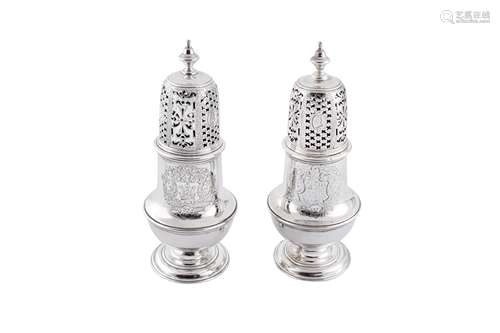 A pair of George II sterling silver ‘portrait’ sugar casters...