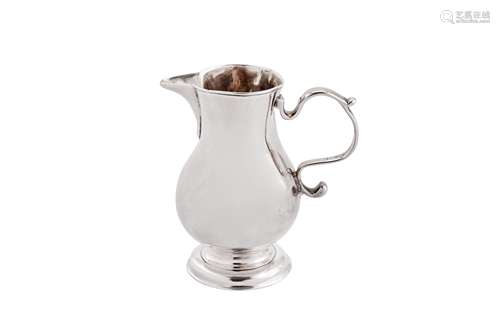 A George II sterling silver ‘sparrow beak’ cream jug, London...